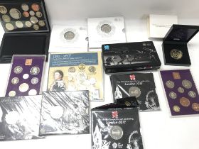 A collection of various commemorative coins and se