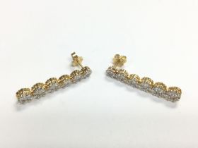 A pair of 18ct gold earrings set with round brilli