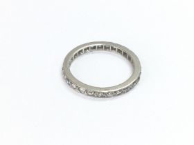 A genuine antique platinum eternity ring set with