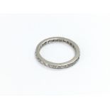 A genuine antique platinum eternity ring set with