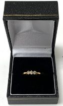 An 18ct gold 3 stone diamond ring, Size J (postage