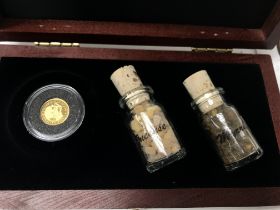 A 1.24g gold proof coin in a presentation box alon