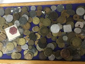 A collection of interesting antique bronze and metal coin tokens.