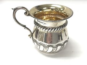 A silver mug with Sheffield hallmarks from 1904. 8