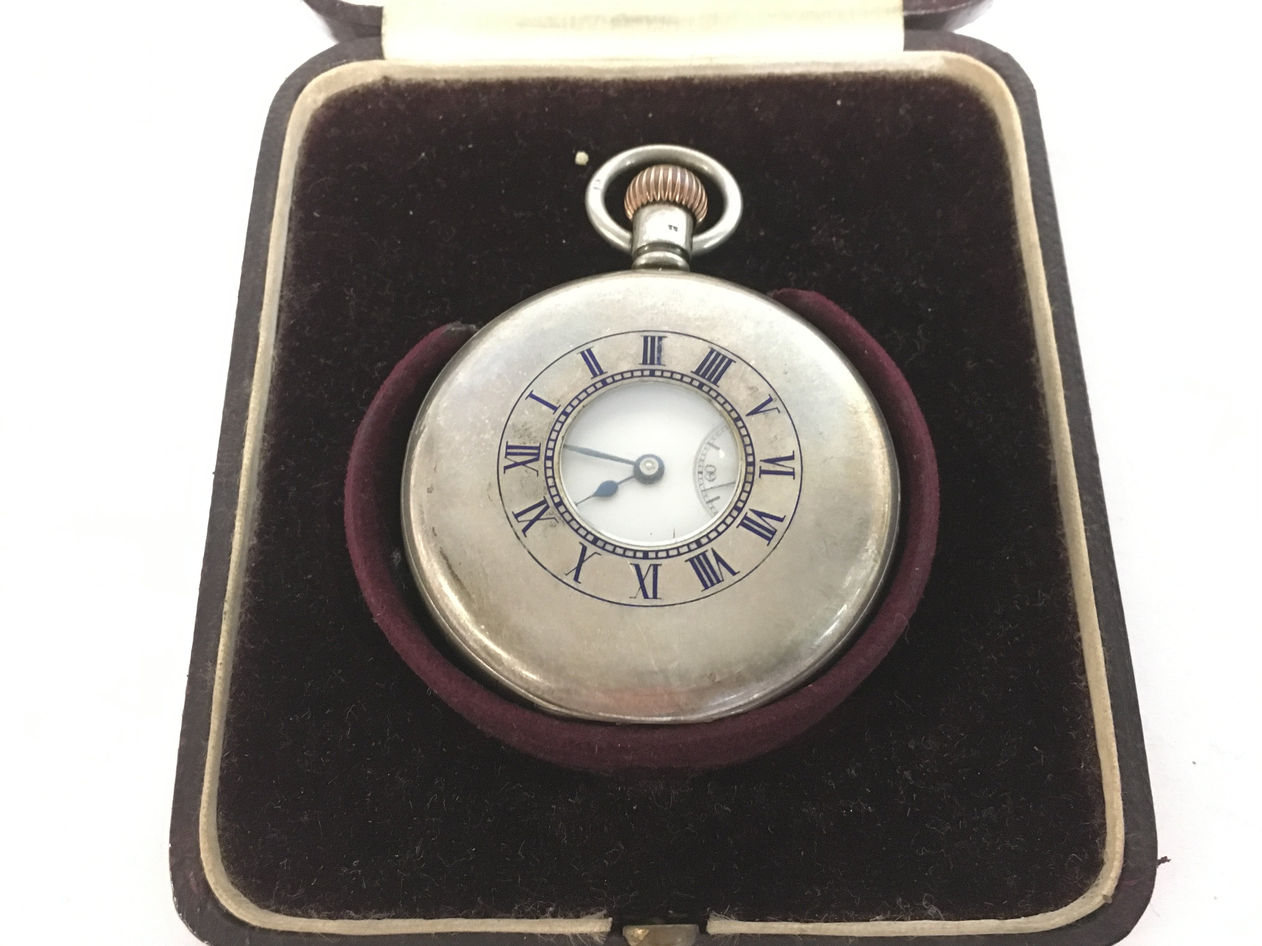 A boxed silver hallmarked half hunter pocket watch