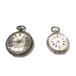 Two silver pocket watches. Left one winds and runs