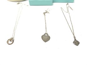 Two silver Tiffany and co necklaces with boxes and