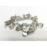 A silver charm bracelet. Shipping category A. NO R