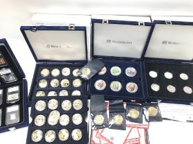 Three cases of commemorative coins including gold