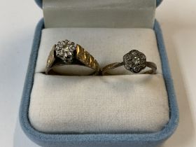 An 18ct gold and 7 stone diamond daisy design ring