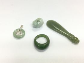 Four jade jewellery items. Shipping category A. NO