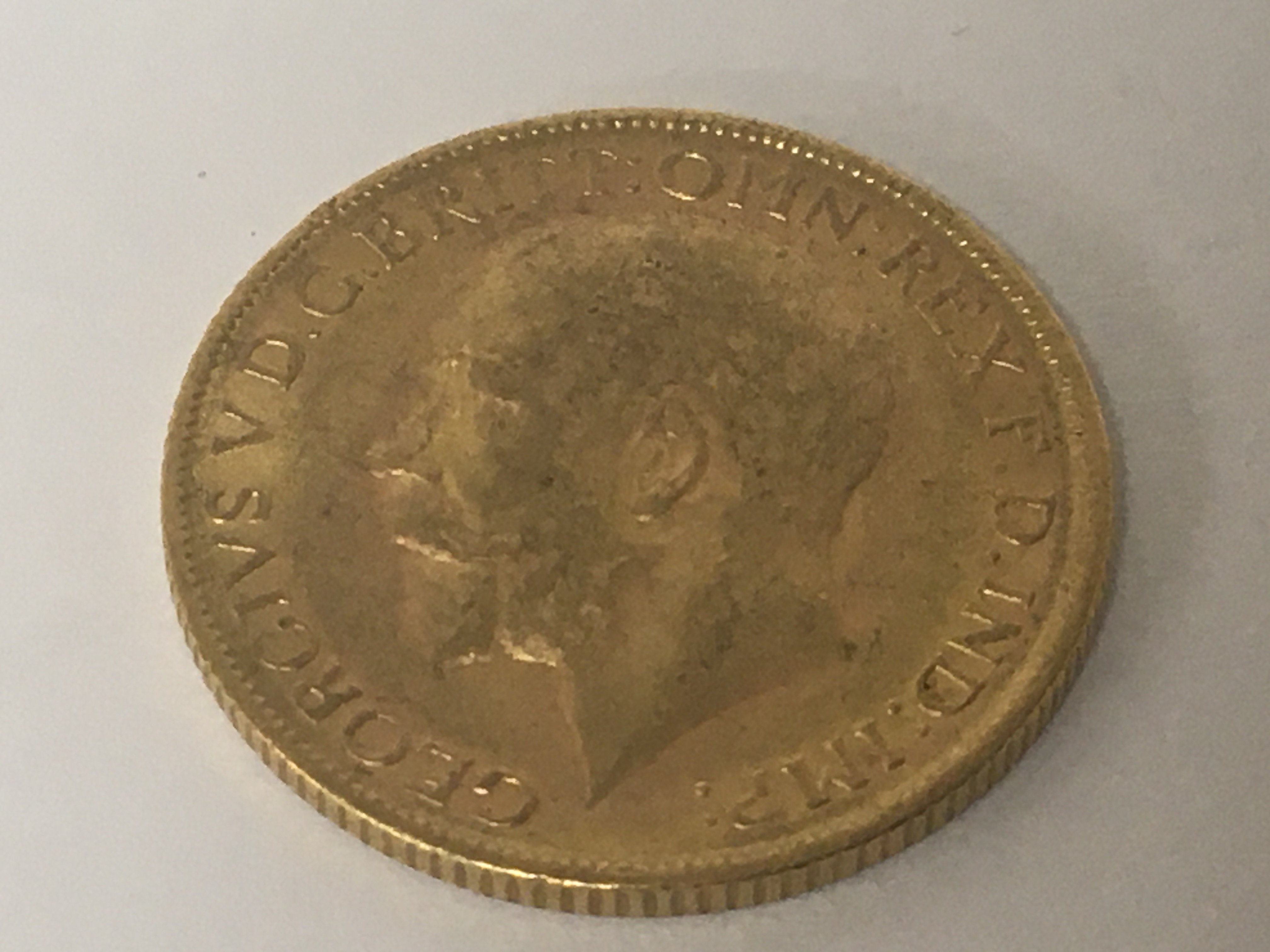 A Gold 1912 George V gold sovereign. - Image 2 of 2