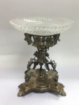 A late 19th Century silver plated and glass centre