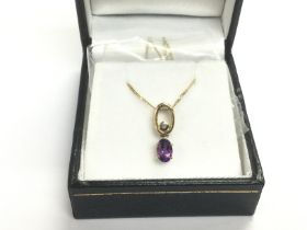 A 9ct gold, oval amethyst and round cut diamond pe