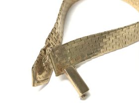 A 9ct gold belt bracelet. 38.7g and 21.5cm long. P
