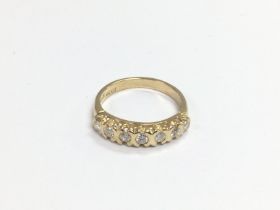 A 9ct gold seven stone half eternity diamond ring,