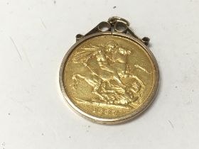An 1887 full sovereign in jewellery mount. Total w