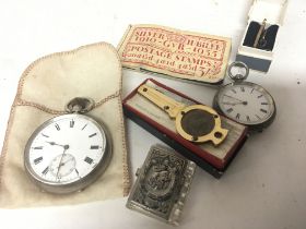 A silver casket button wind pocket watch seen work