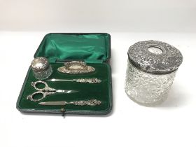 A silver Hallmarked manicure set and a silver topp