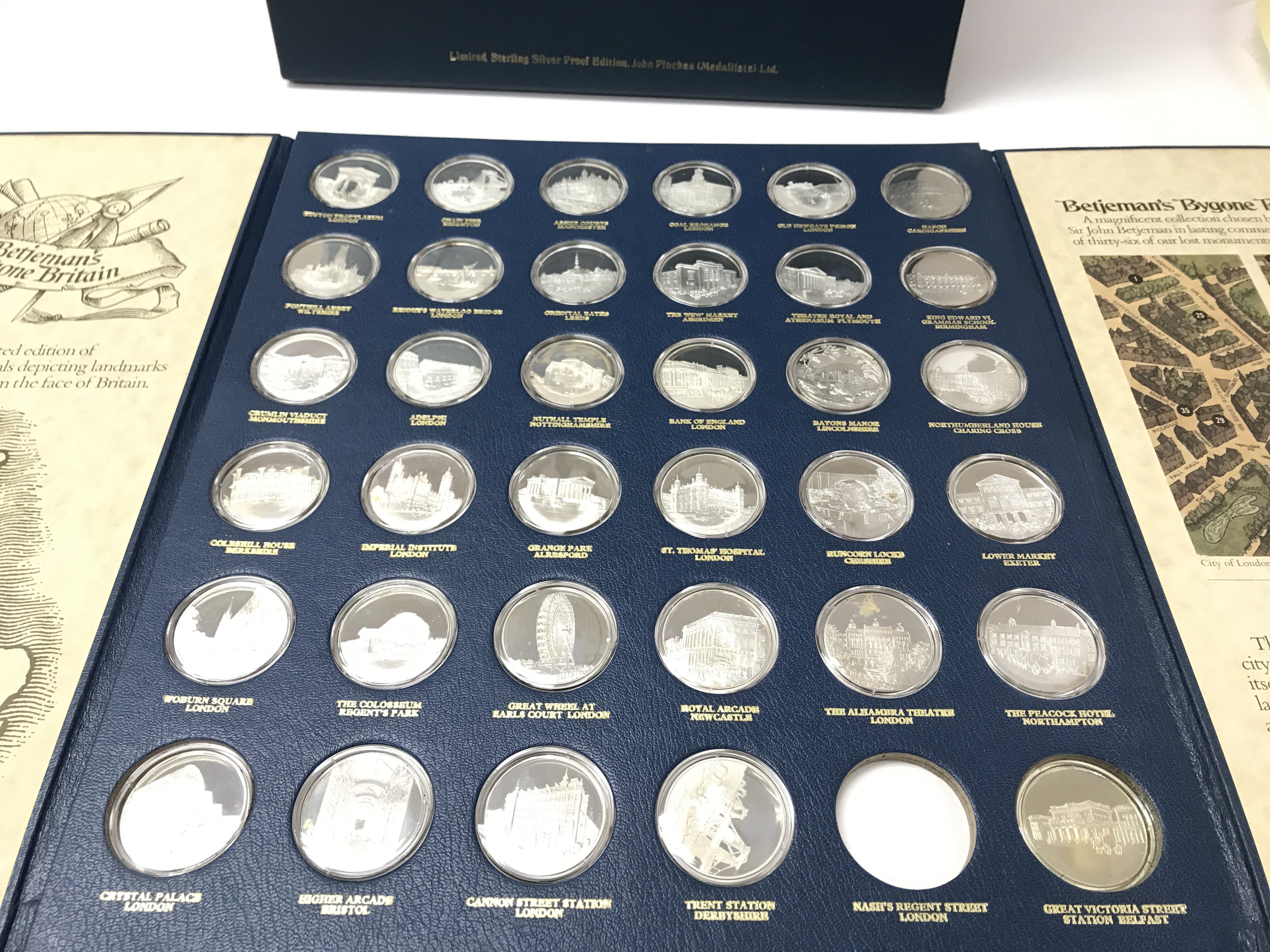 A set of silver proof medals depicting landmarks o