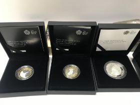 A collection of 6 silver proof coins.