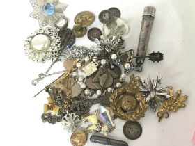 A collection of silver and costume jewellery Milit