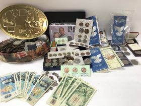 A large collection of mixed coinage and bank notes