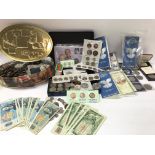 A large collection of mixed coinage and bank notes