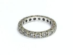 An 18ct white gold eternity ring, approx size L an