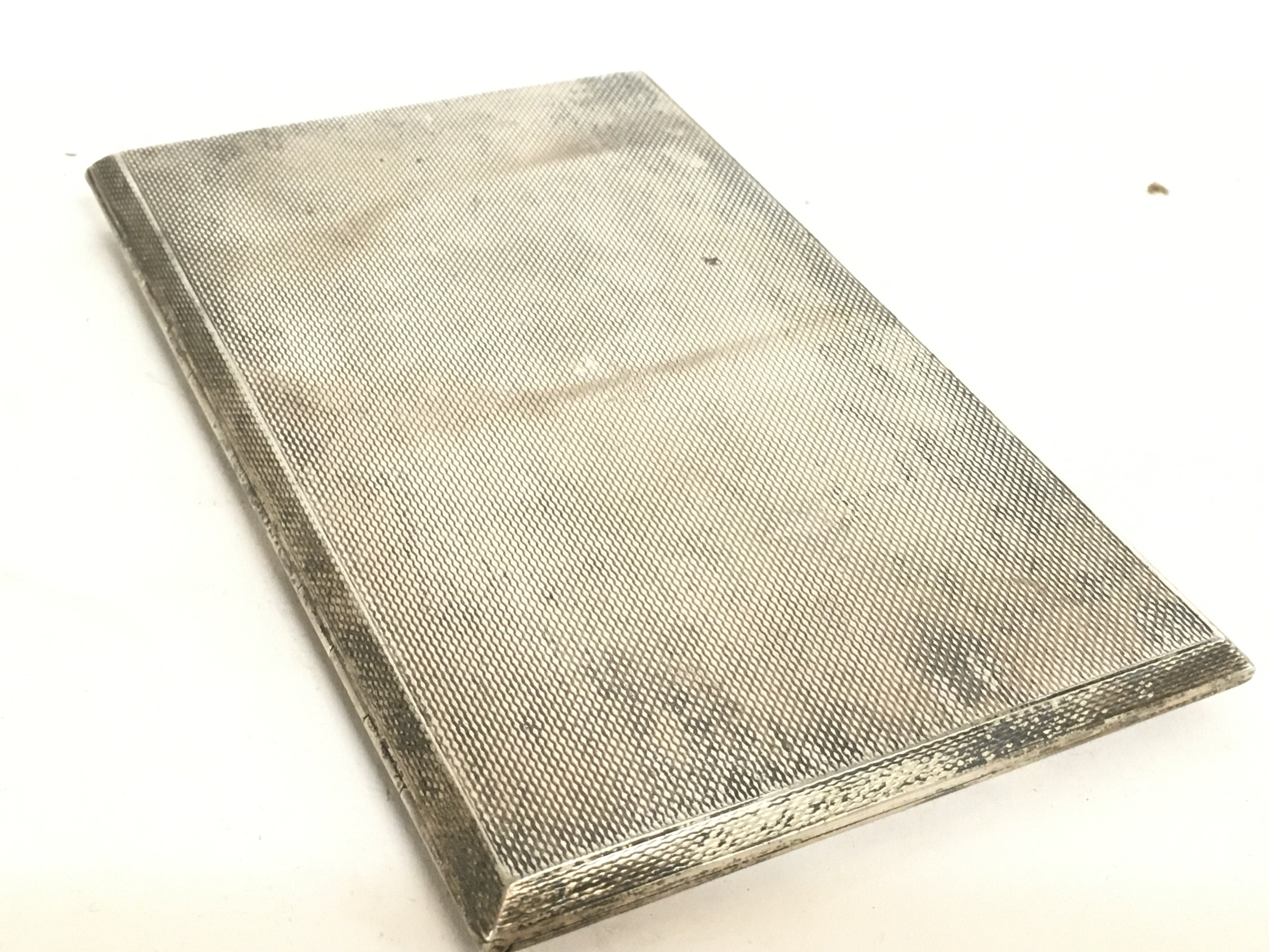 A silver hallmarked cigarette case, postage catego