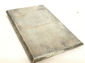 A silver hallmarked cigarette case, postage catego