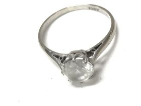 An 18ct white gold ring set with white stone. Size