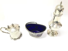 A collection of assorted silver items including a mustard pot and sugar sifter and a silver and