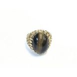 A gold clad ring inset with agate. 6.74 and size Q