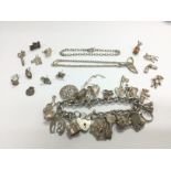 WITHDRAWN -A silver charm bracelet, silver charms etc. Shippi