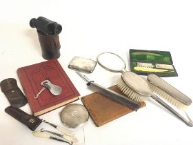 A collection of assorted items including silver ha
