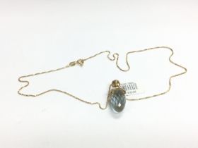 A crystal pendant on a chain. Shipping category A.