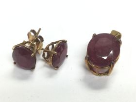 A pair of 9ct gold ruby earrings set with rubies t