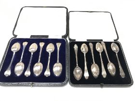 Two sets of cased silver spoons on from Sheffield