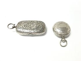 A silver stamp and sovereign case with Birmingham 1907 hallmarks and a silver sovereign vase with