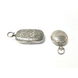 A silver stamp and sovereign case with Birmingham 1907 hallmarks and a silver sovereign vase with