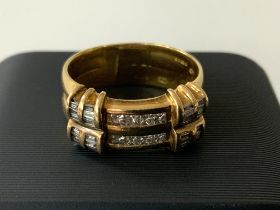 An 18ct gold double ring set with round brilliant