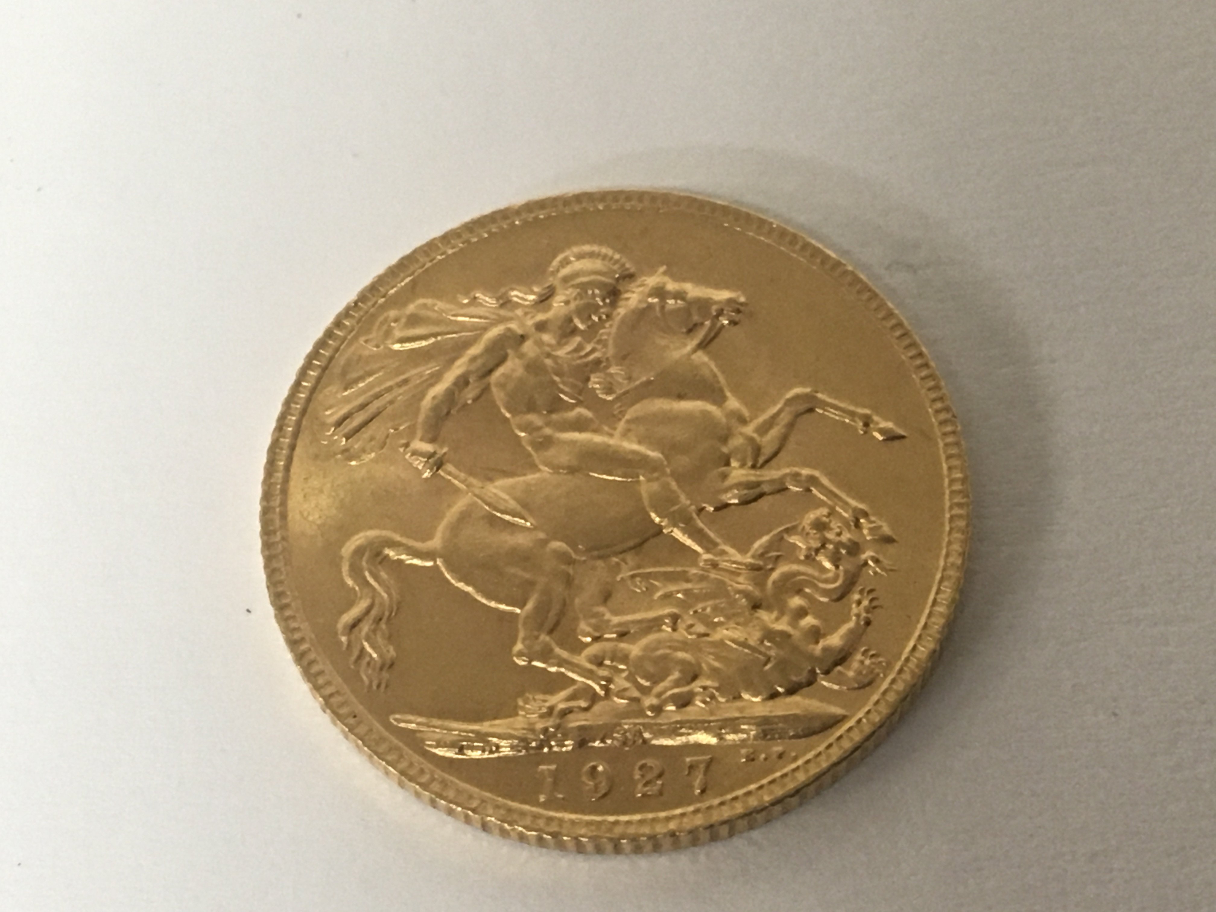 A 1927 George V gold sovereign.