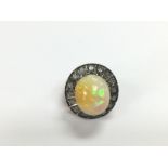 A large 14ct gold and silver, oval cabochon Ethiop