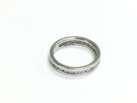 An 18ct white gold eternity ring, approx size J-K