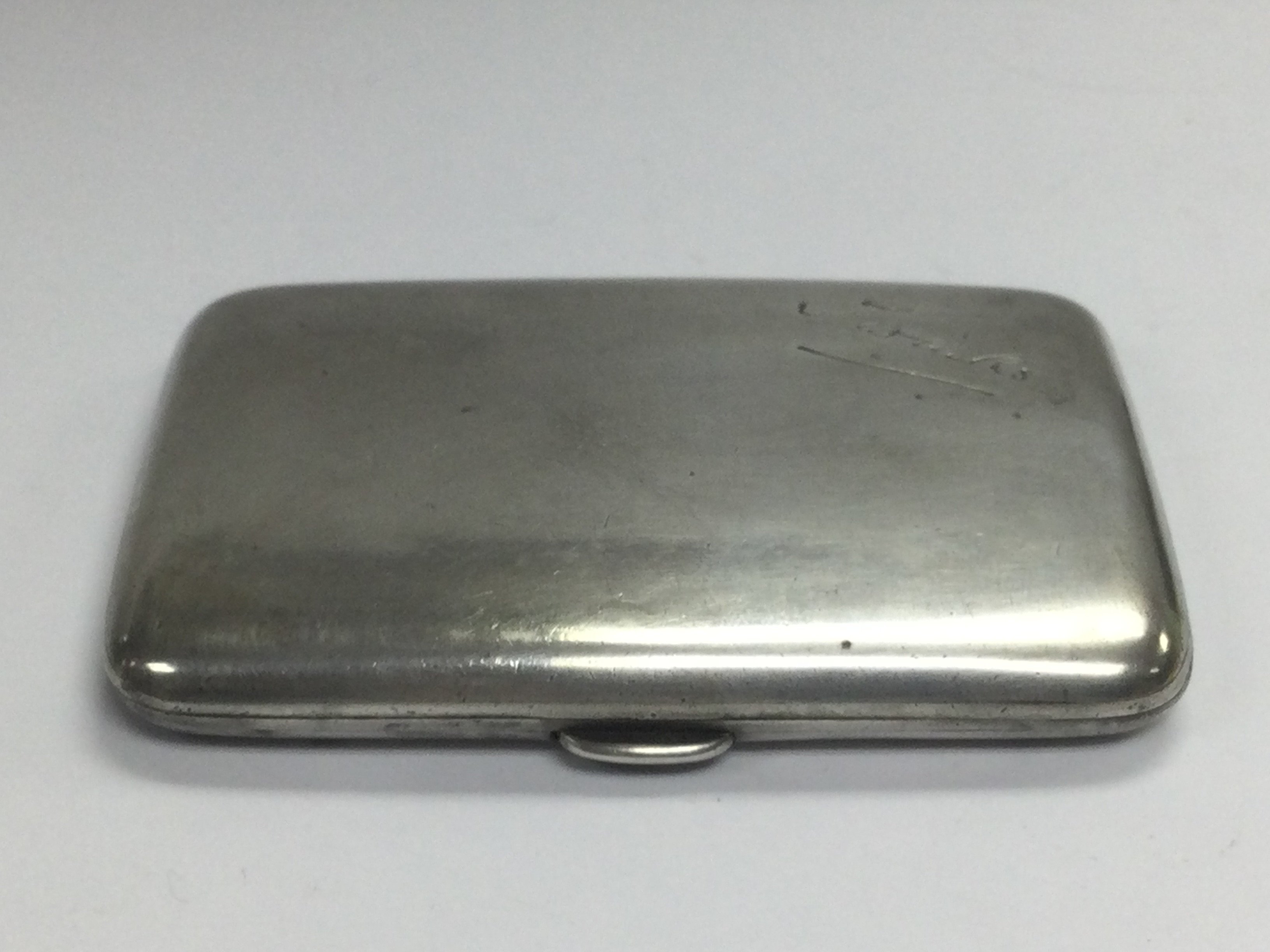 An Asprey silver cigarette case, Chester 1917. Shi