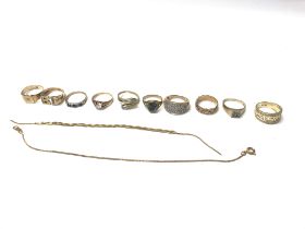 A collection of 9ct gold rings and chains totallin