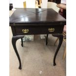 A Edwardian mahogany envelope card table with sing