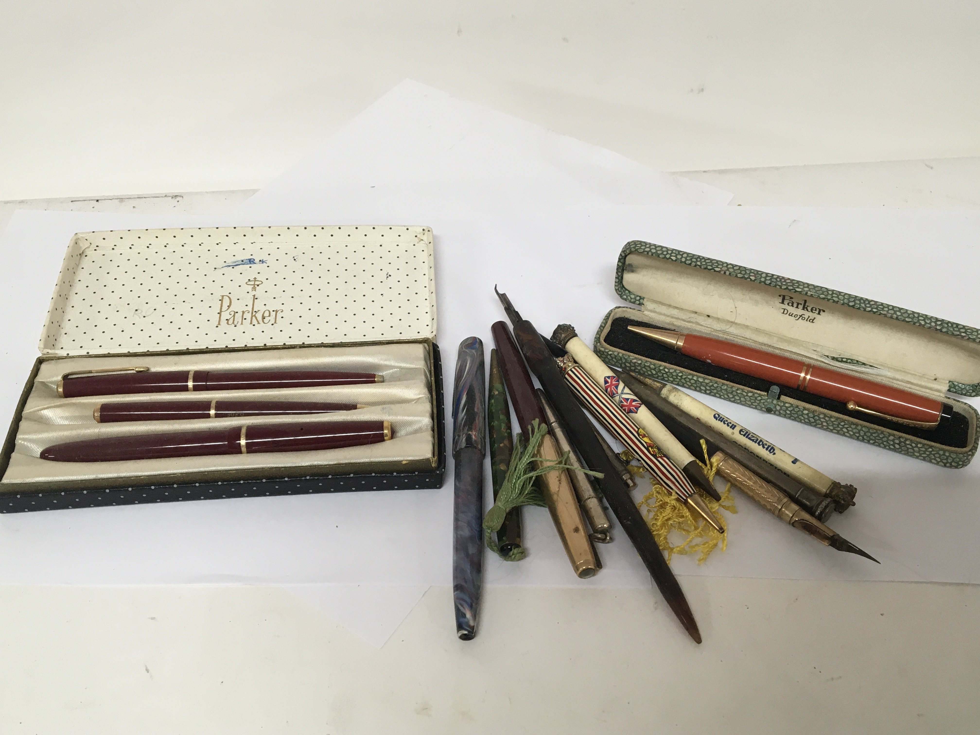 A collection of Vintage fountain pens silver cased