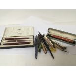 A collection of Vintage fountain pens silver cased